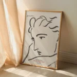Affiche sous verre Henri Matisse Profil de femme avec cadre noir mat dans un salon lumineux au style déco bohème et minimaliste